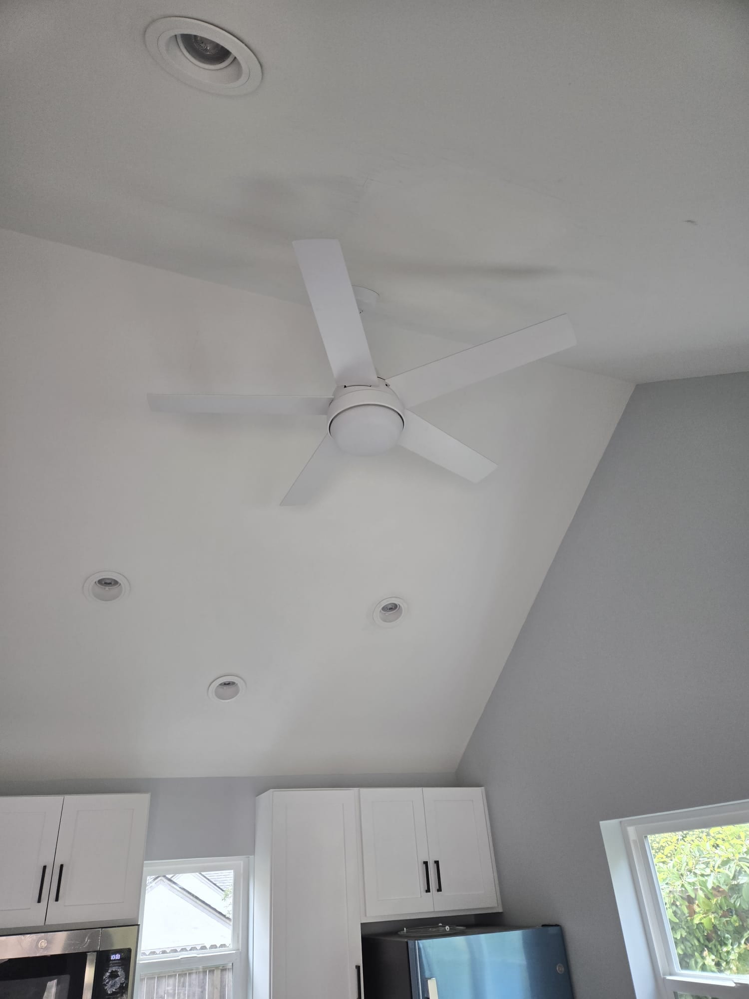 47th St. ADU vaulted ceiling with ceiling fan above the kitchen