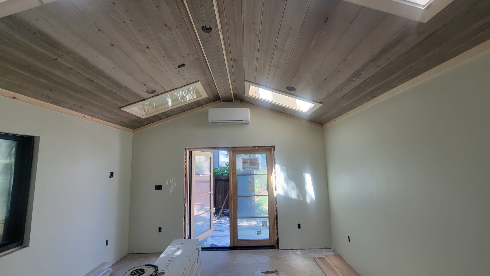 ADU great room with vaulted wood ceiling