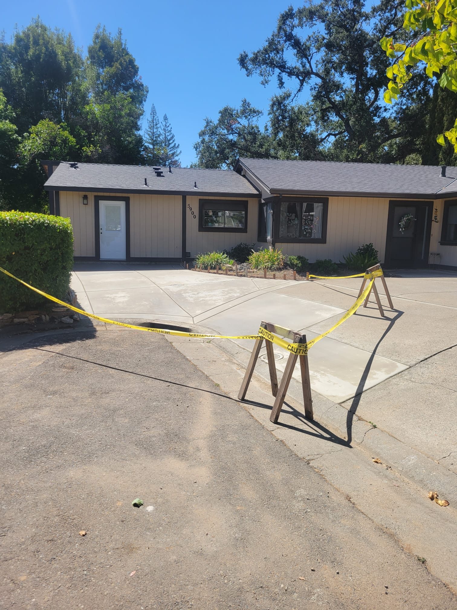 ADU exterior with caution tape during finishing work