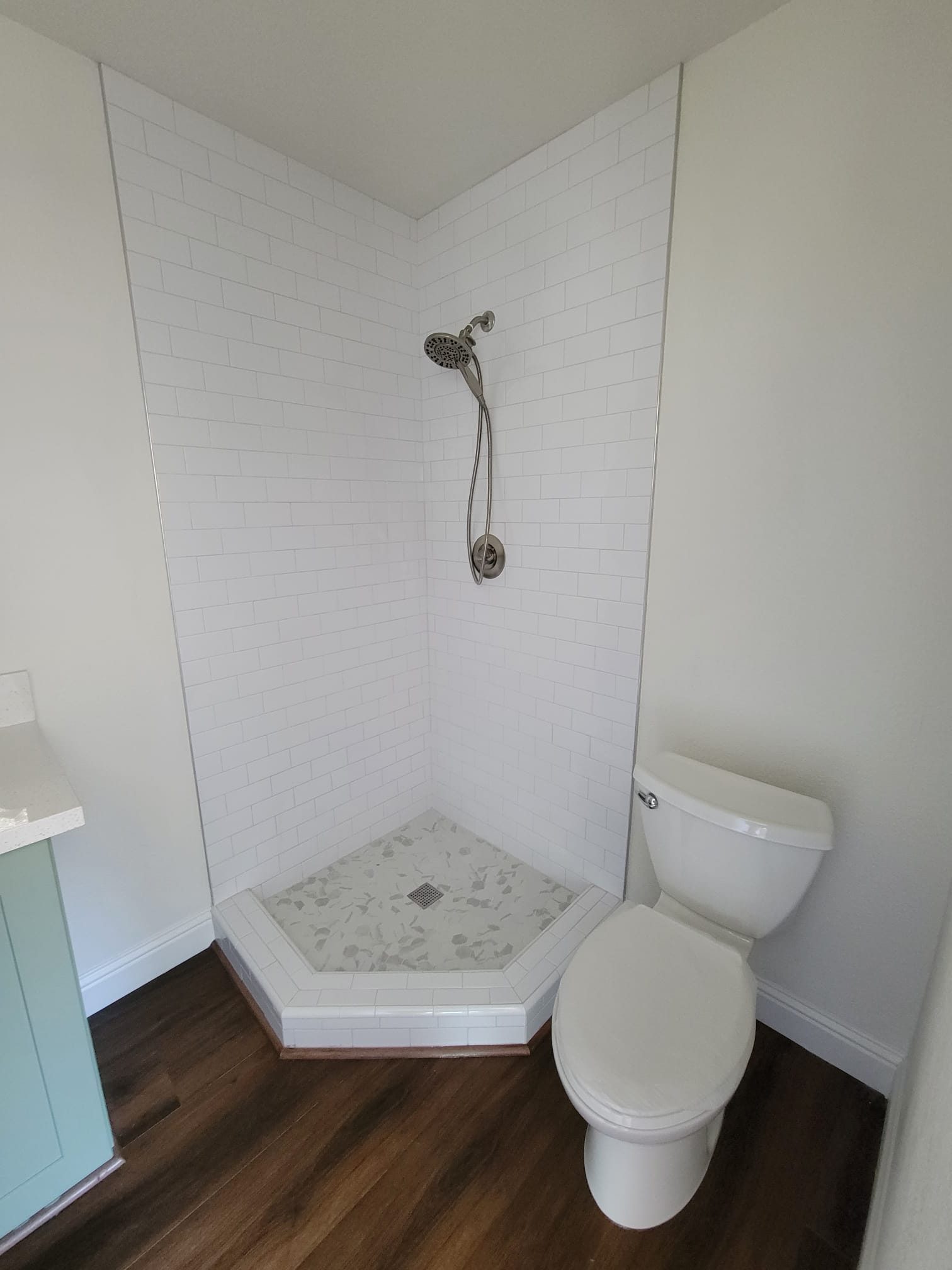 ADU bathroom with tiled shower and toilet