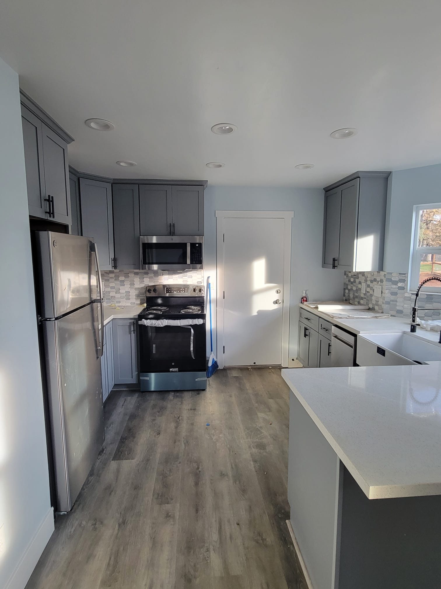 ADU kitchen, alternate angle with pendant light