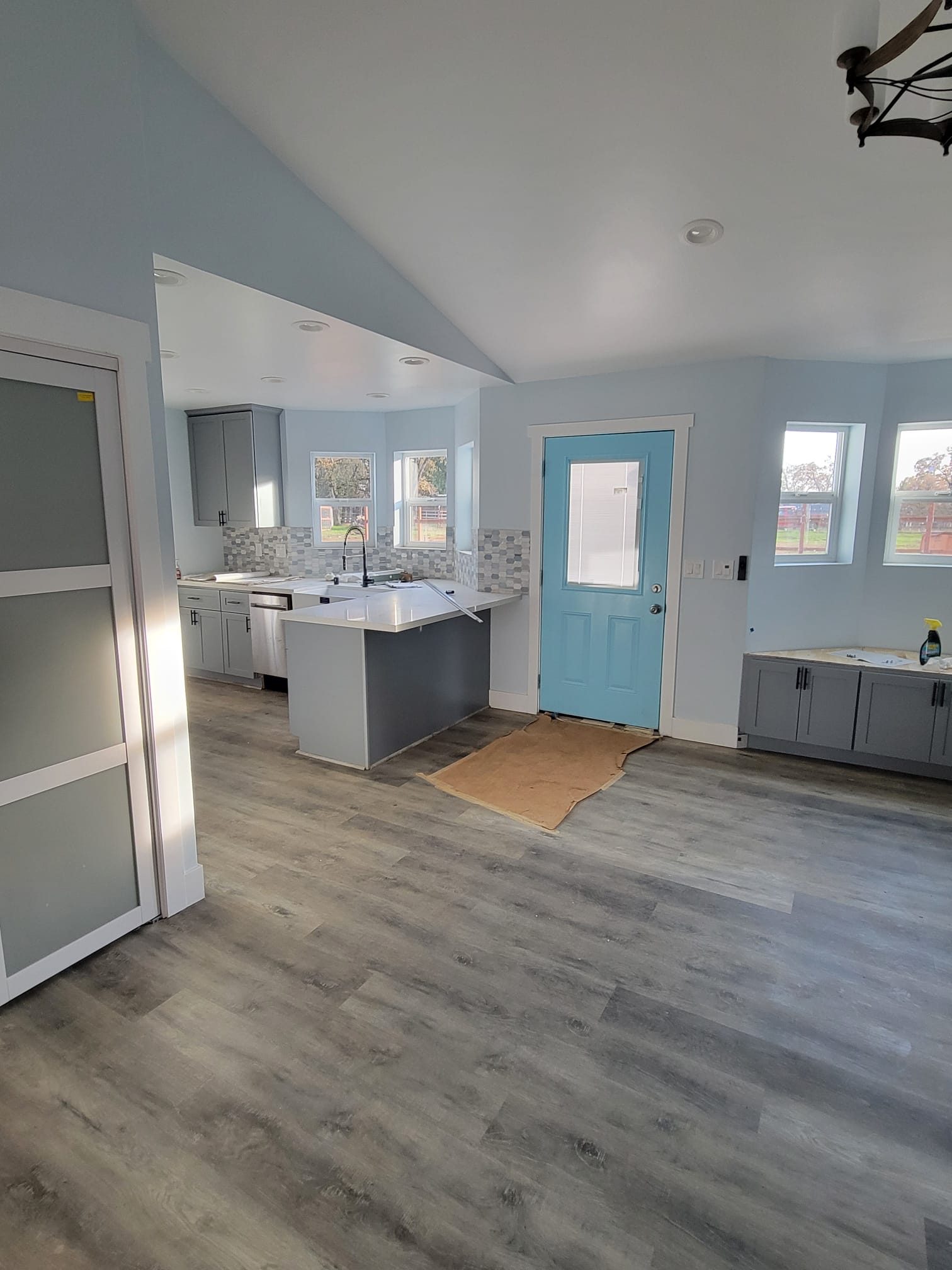 ADU open living area with teal front door