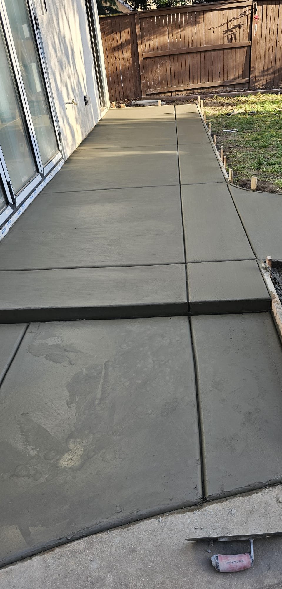 New concrete patio poured alongside ADU
