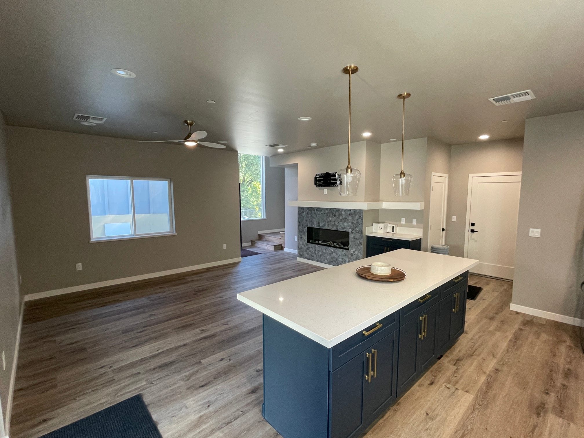 ADU great room with kitchen island and fireplace