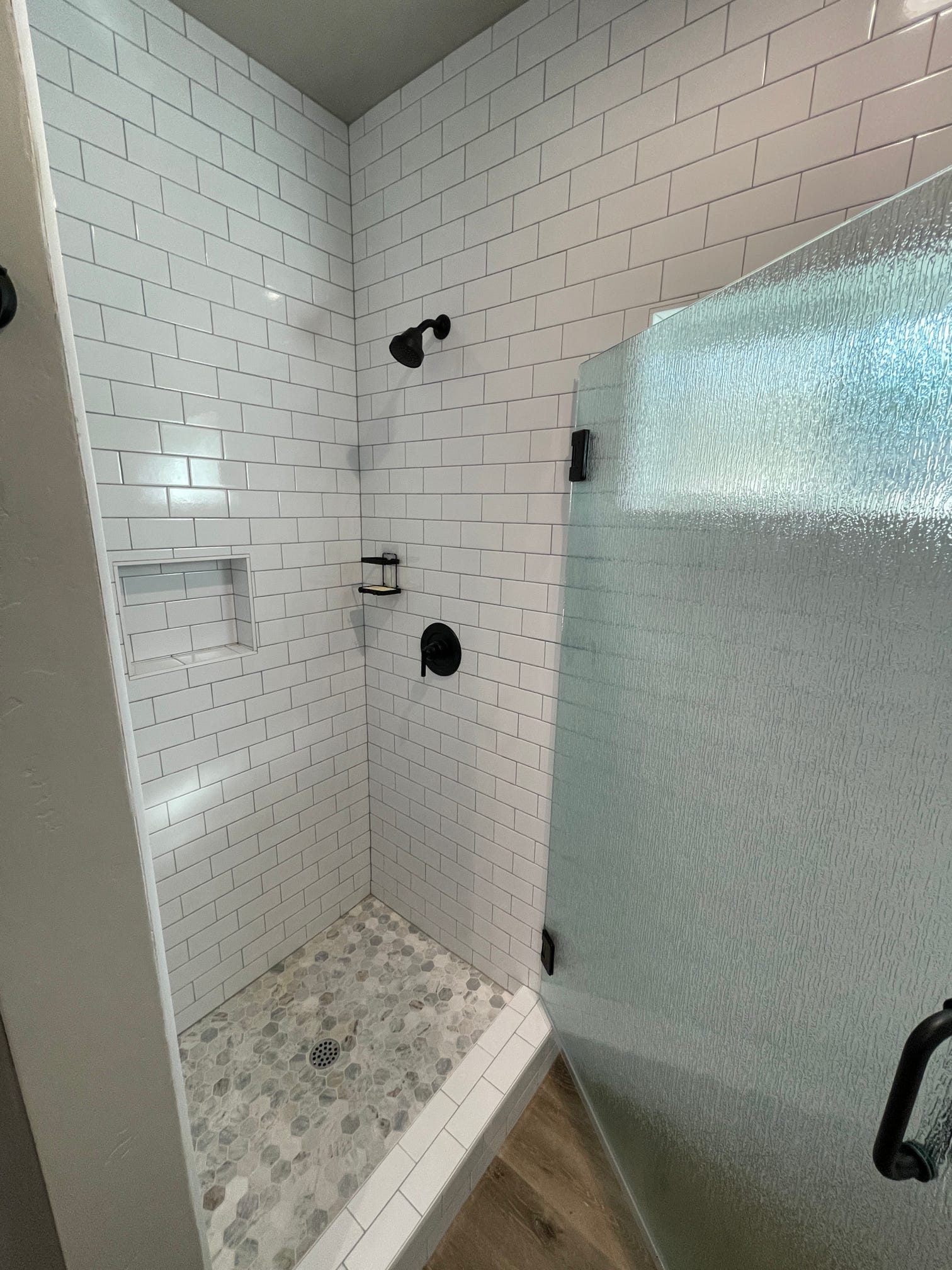 ADU bathroom with subway tile shower