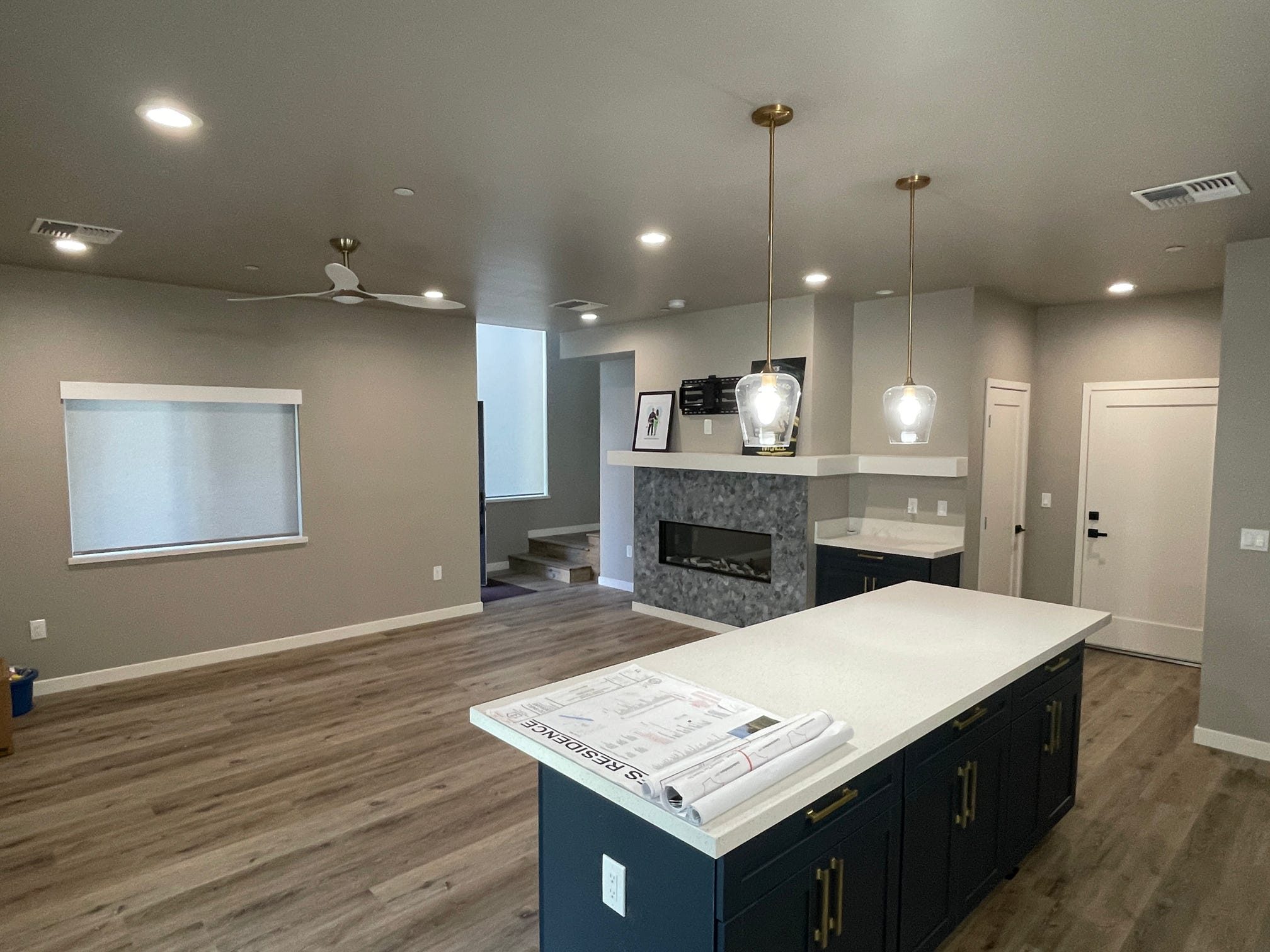 ADU great room with fireplace and kitchen island