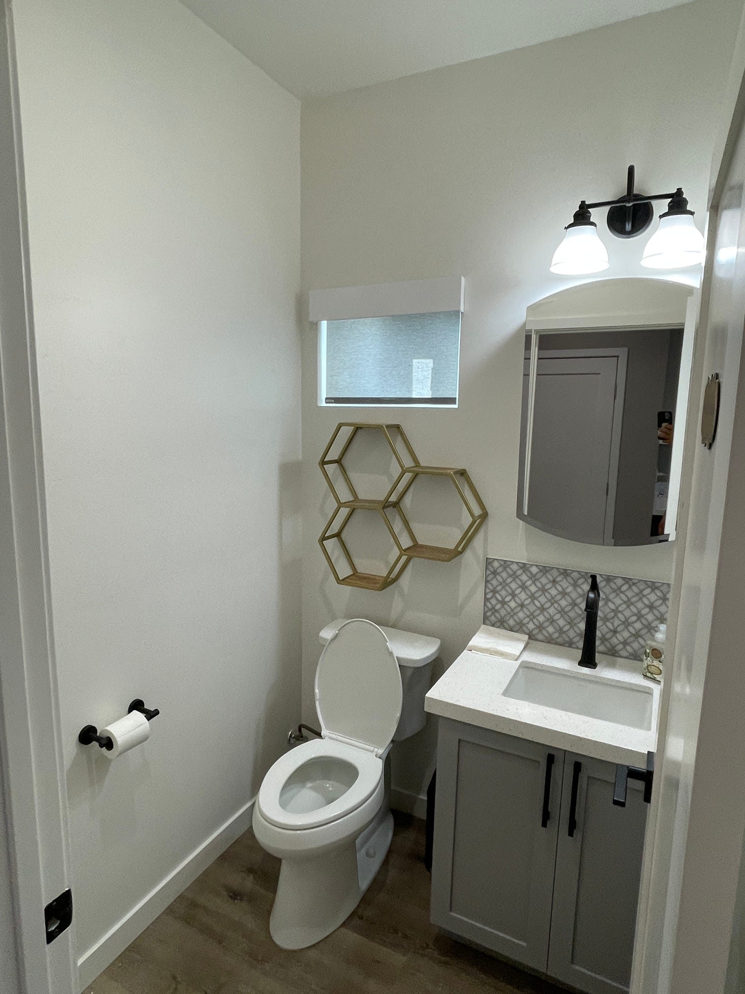 ADU bathroom with pedestal-style vanity