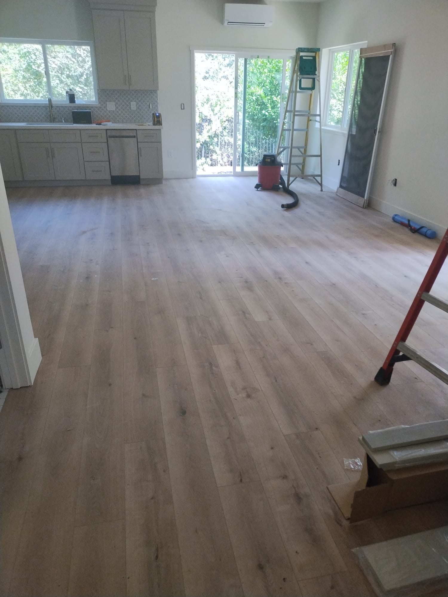 ADU living area with wood-look flooring