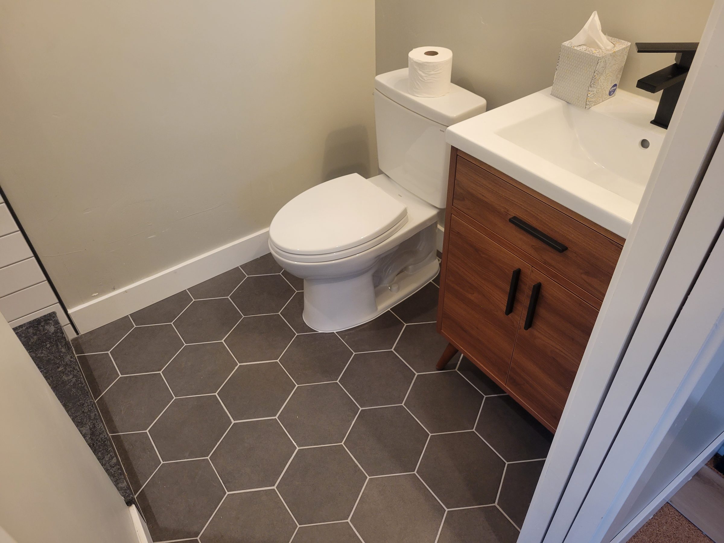 Modern ADU toilet and walnut vanity