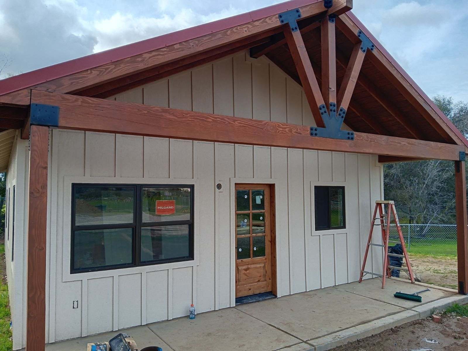 Barn-style ADU exterior with timber accent gable