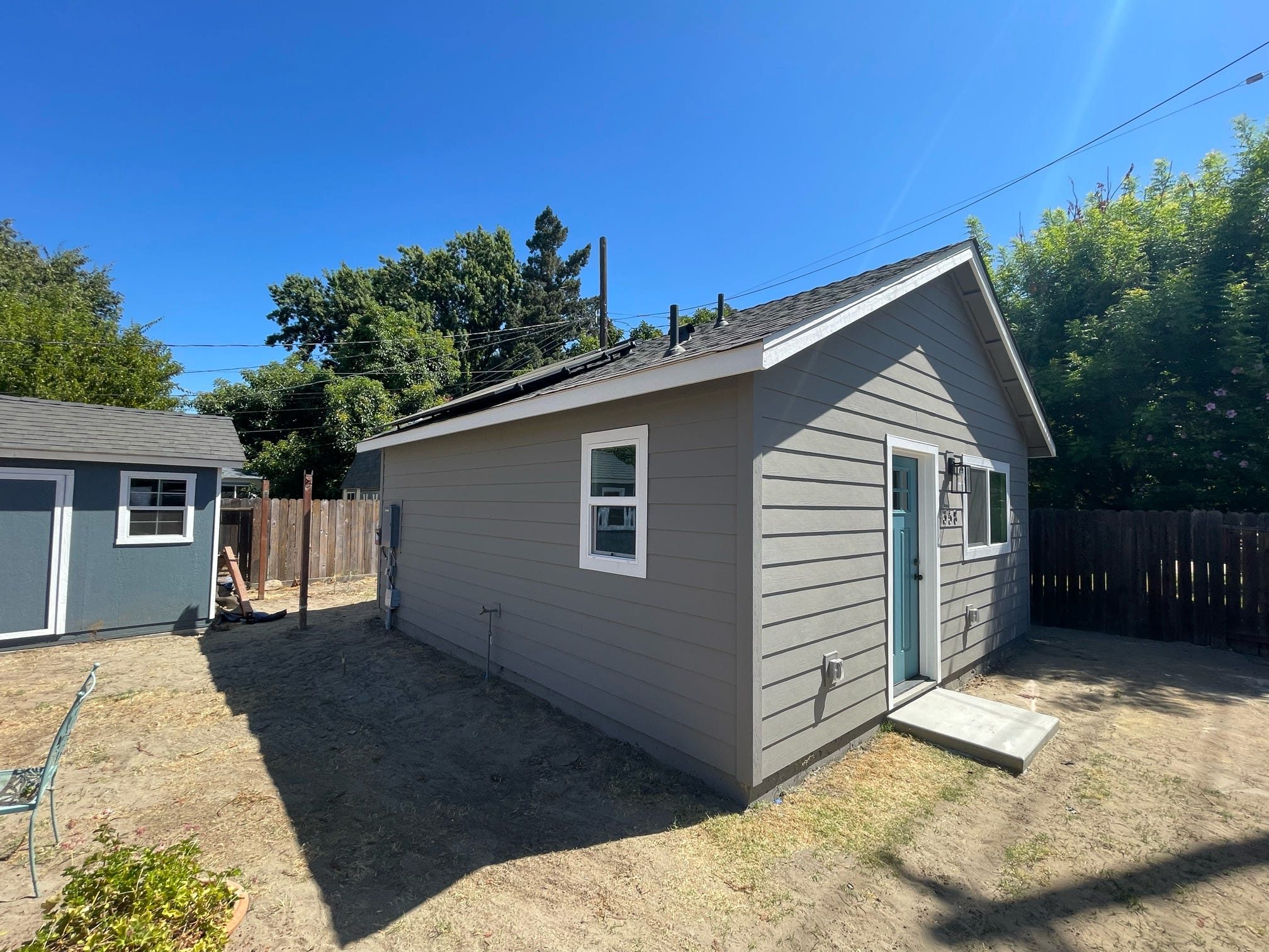 ADU exterior, alternate angle with storage shed