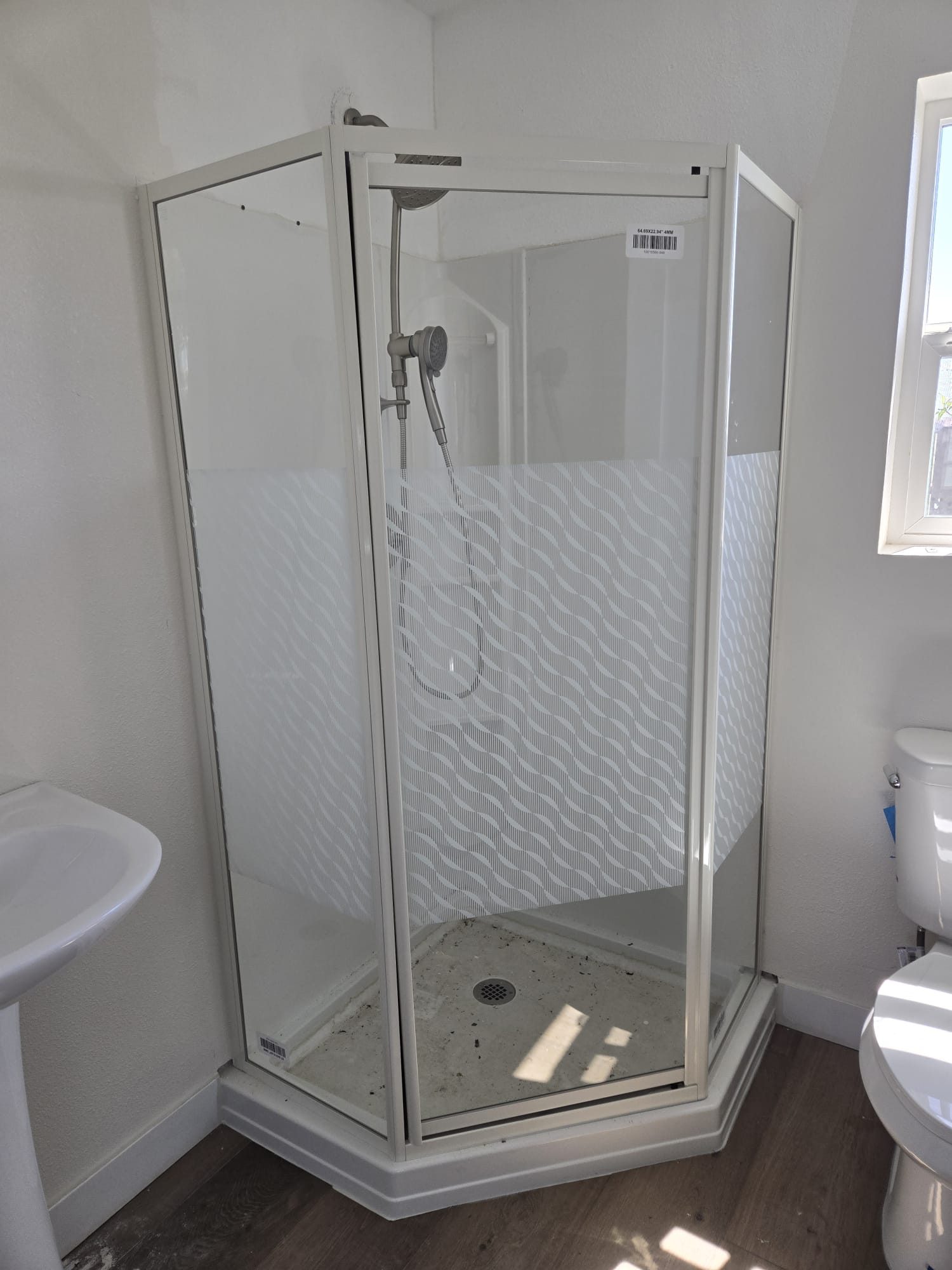 ADU bathroom with corner shower stall