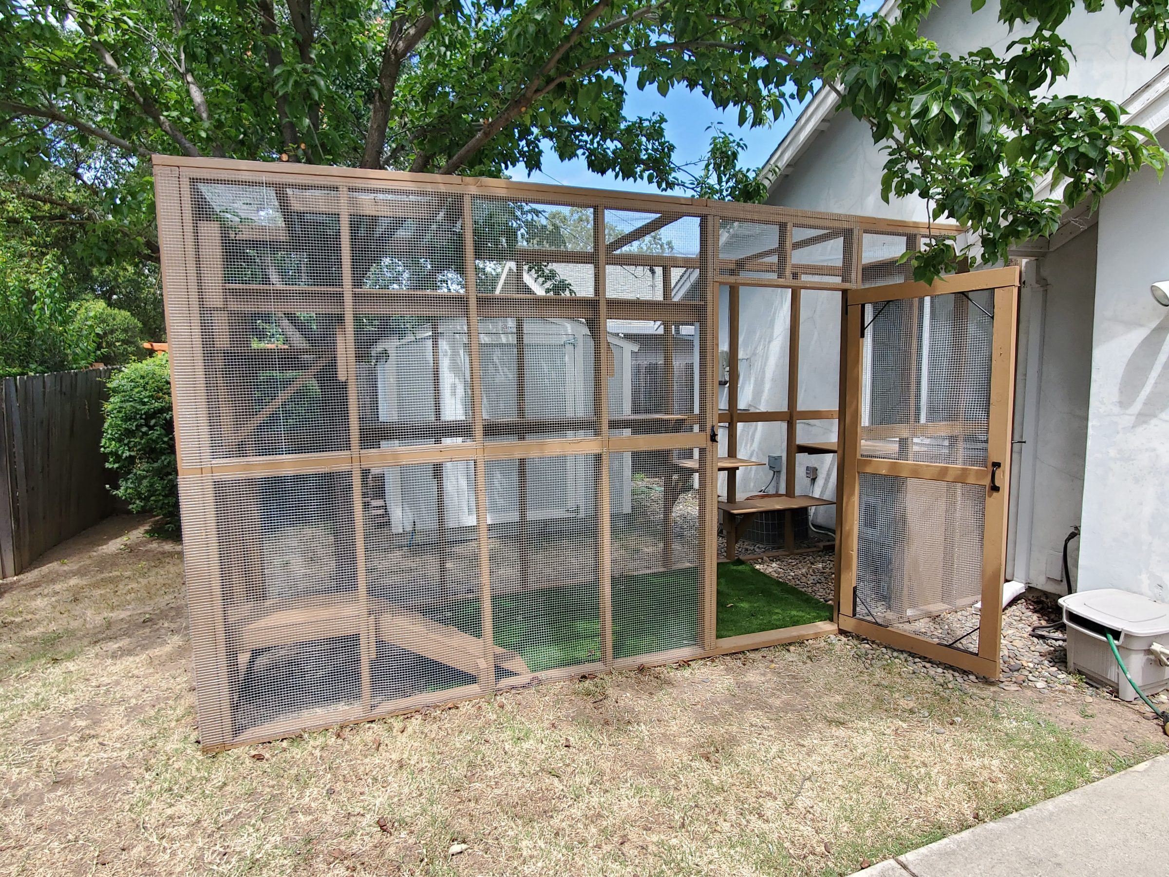 Catio with an open access door and ramp inside