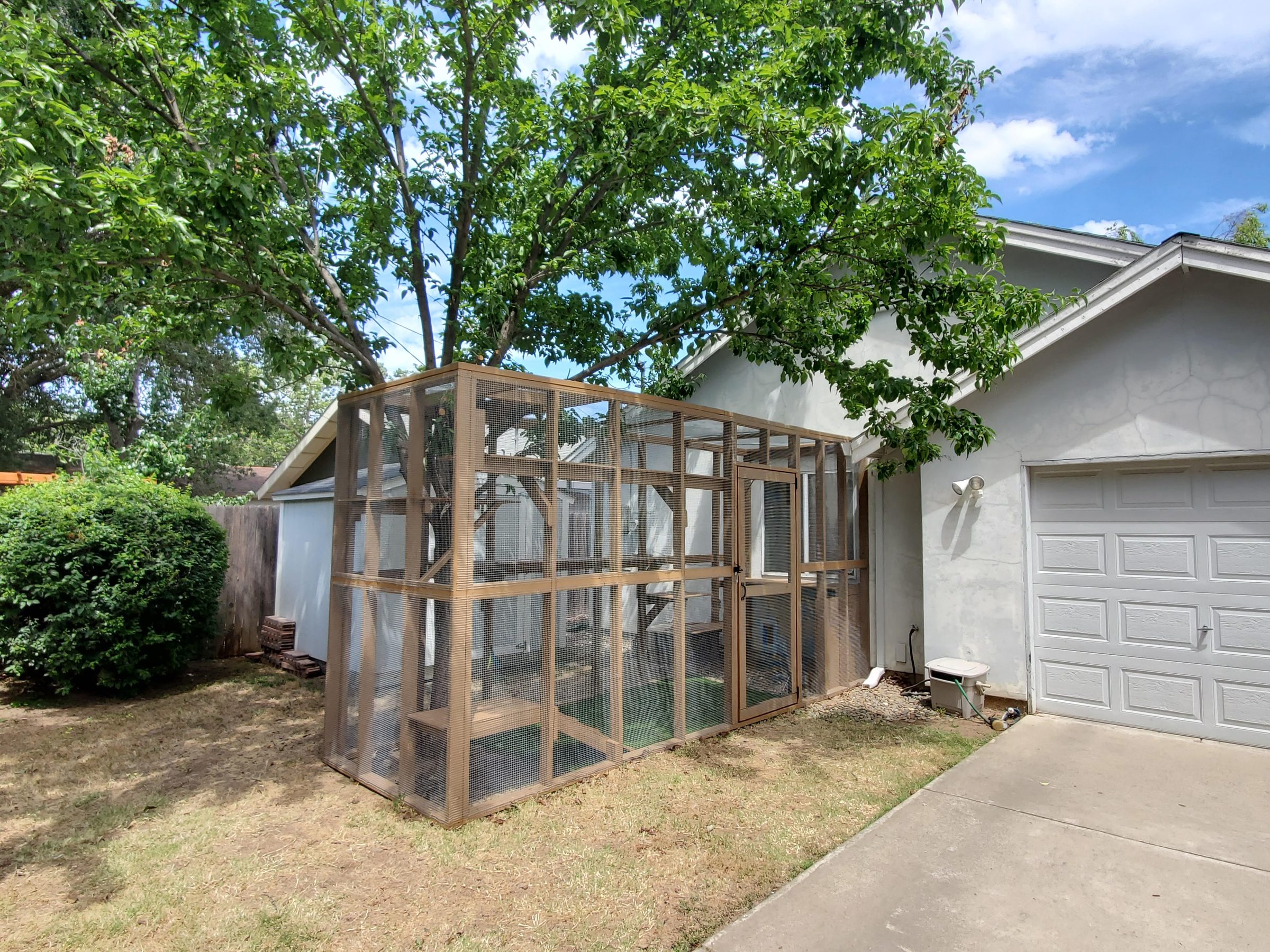 Catio in place beside the garage