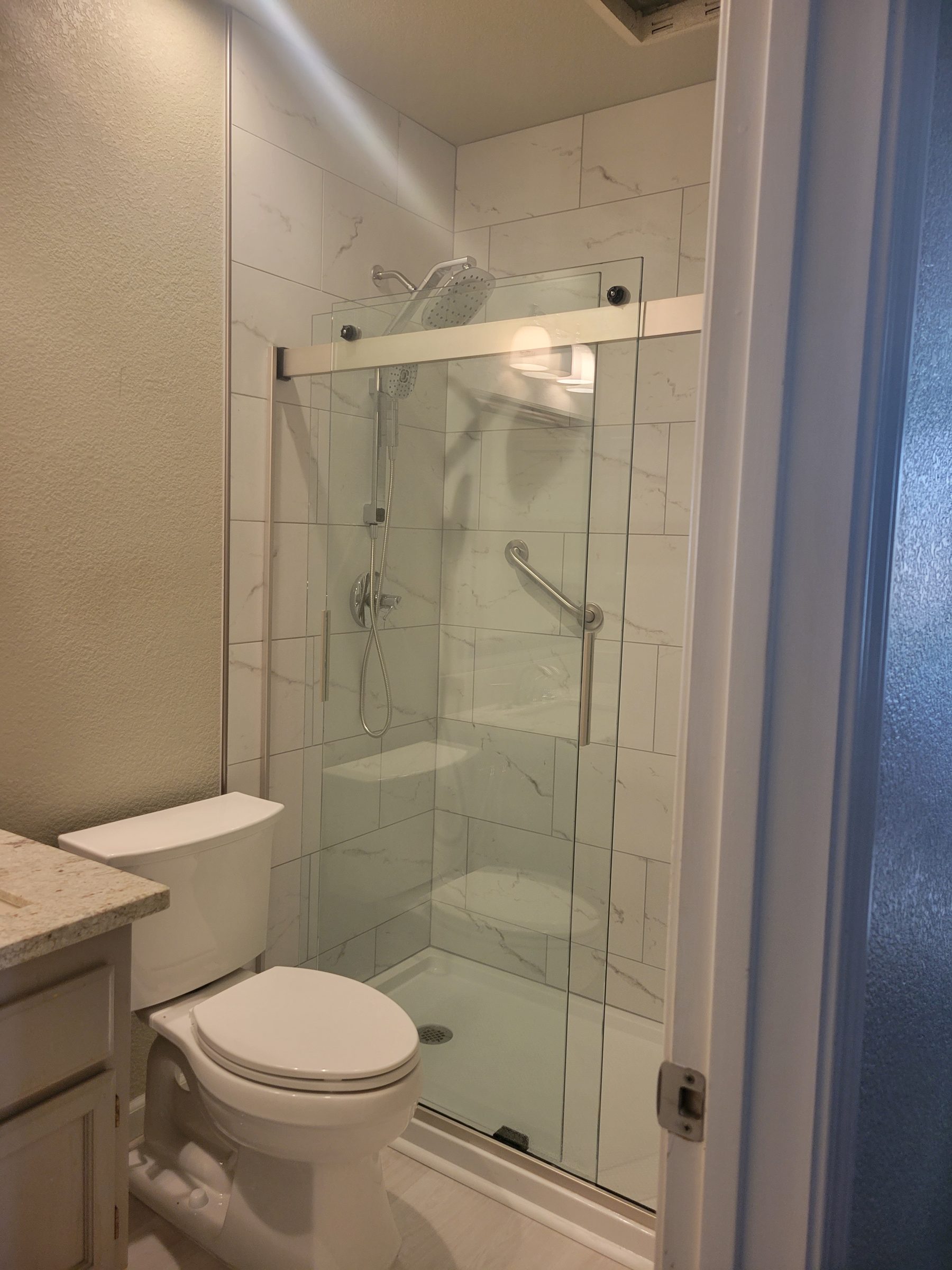 Glass shower enclosure and tile