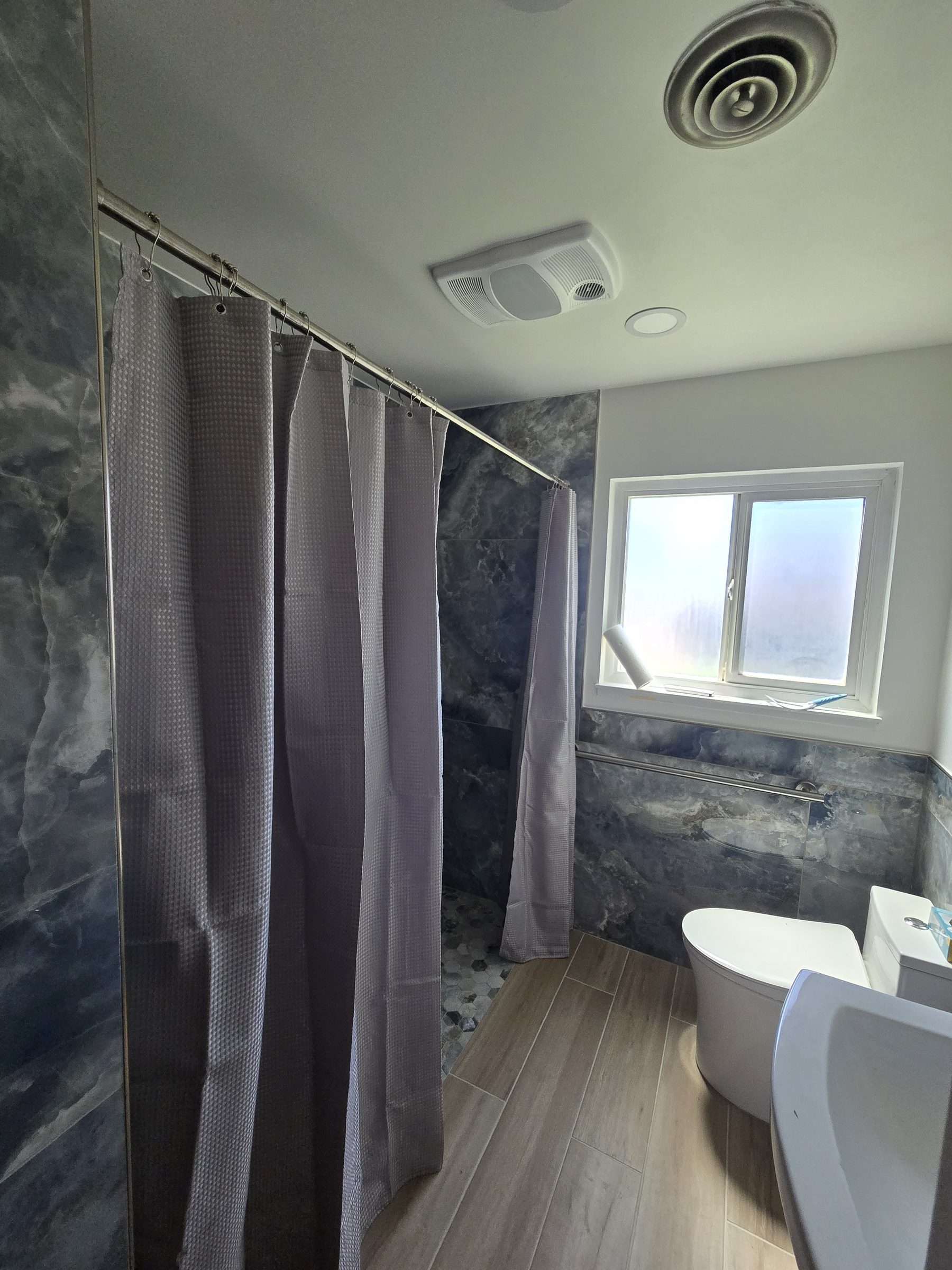 Blue marble-look tile shower