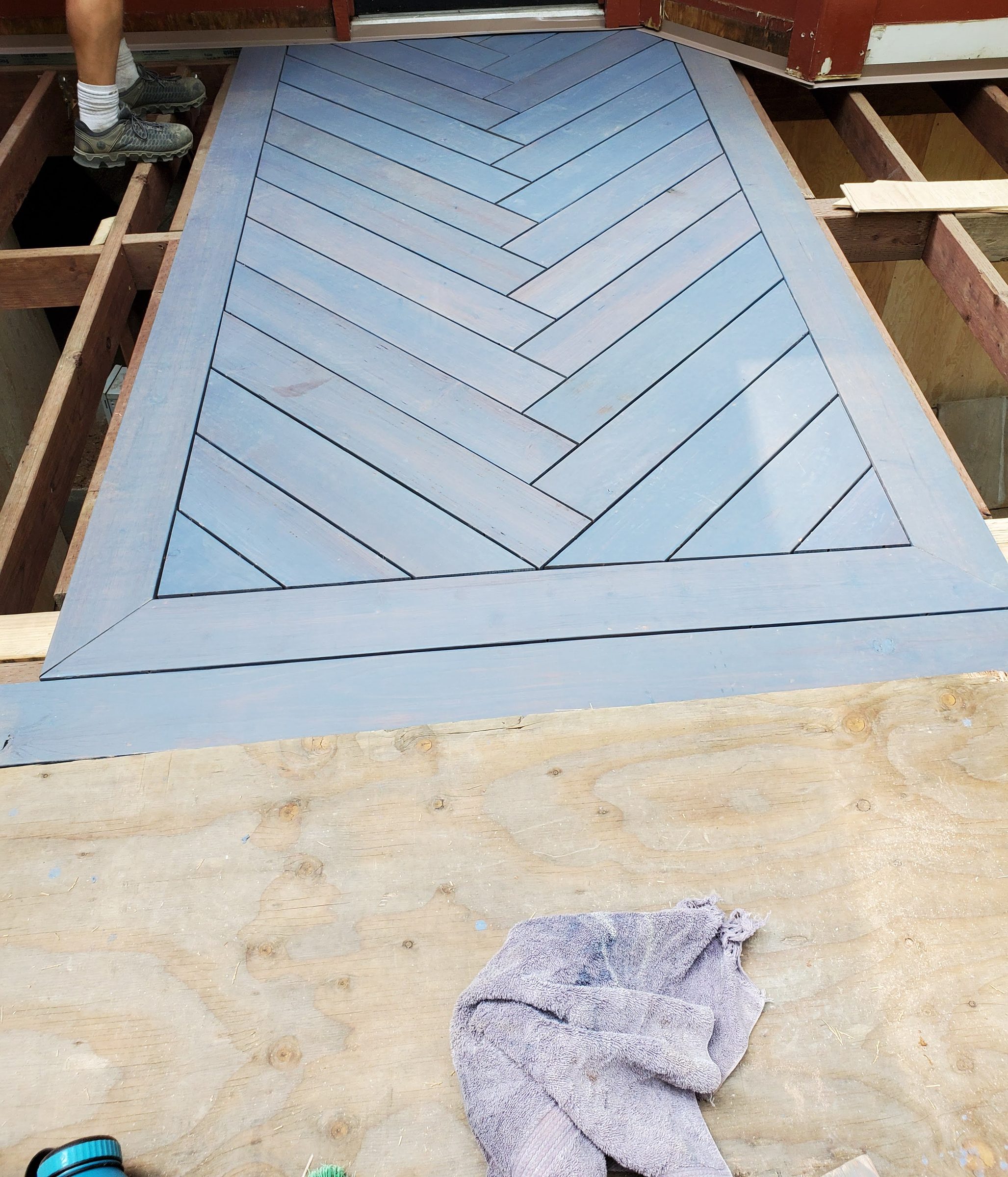 Herringbone-pattern deck inlay during installation