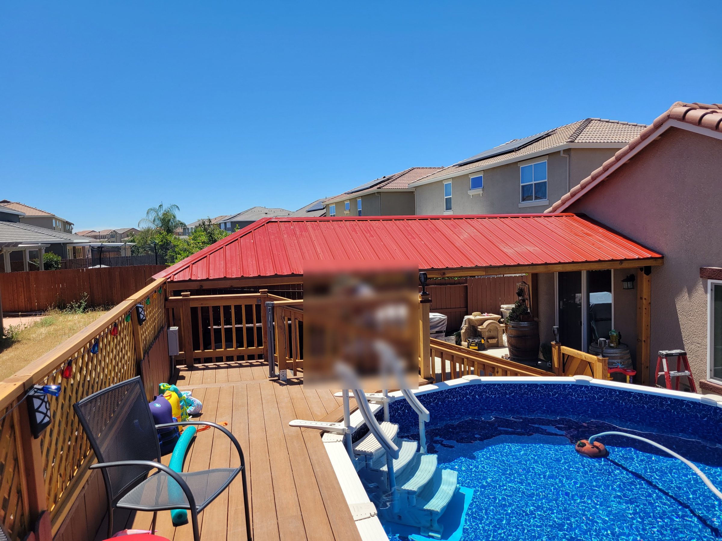 Covered entertainment structure and deck
