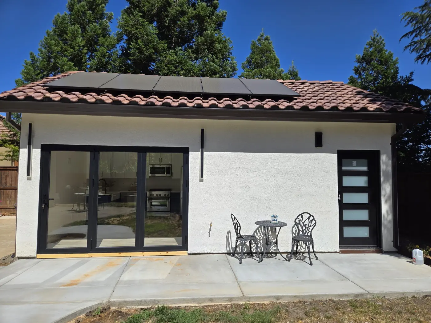 Finished modern ADU exterior and patio viewed straight on