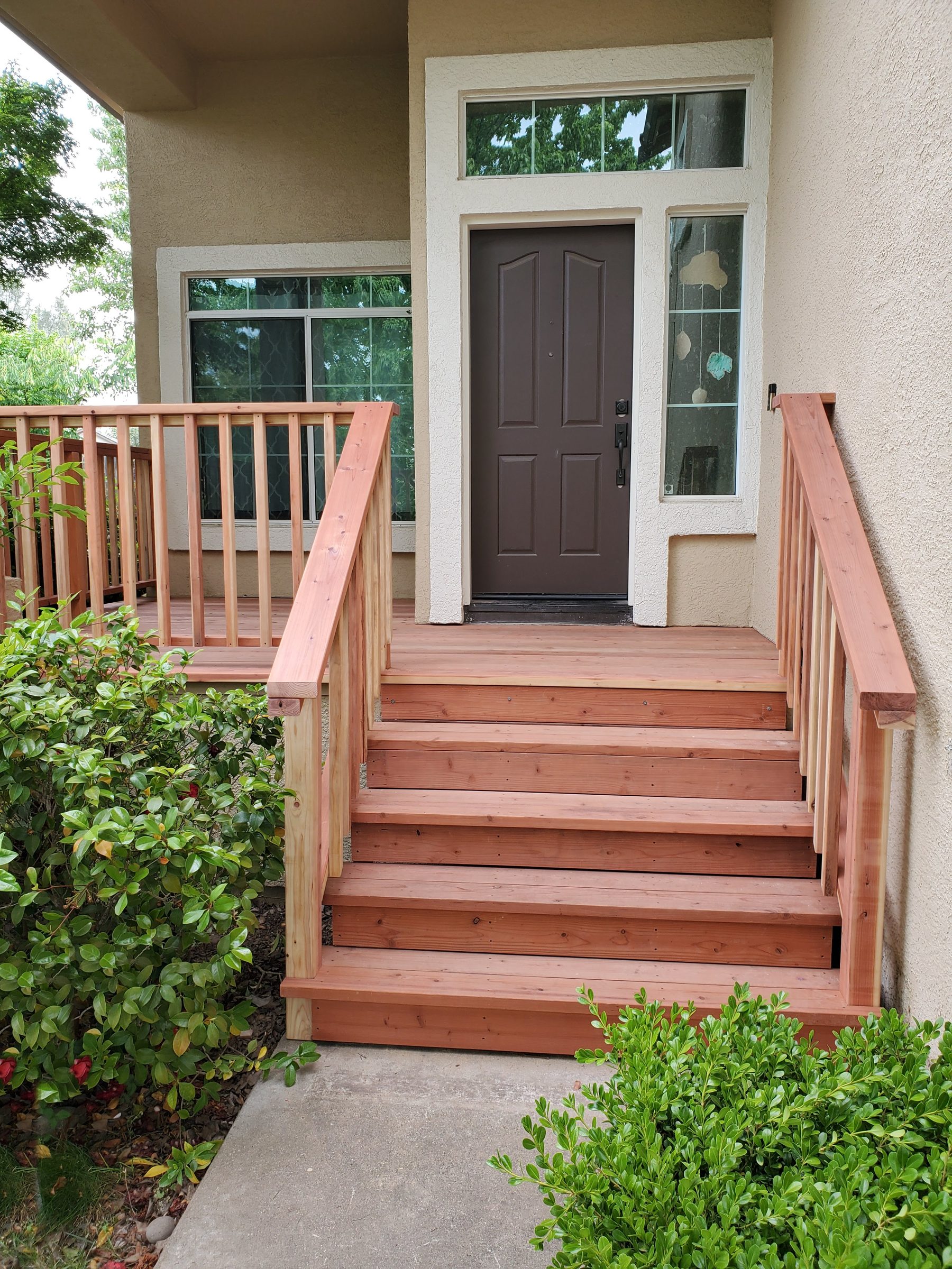 Front steps and porch landing with railing