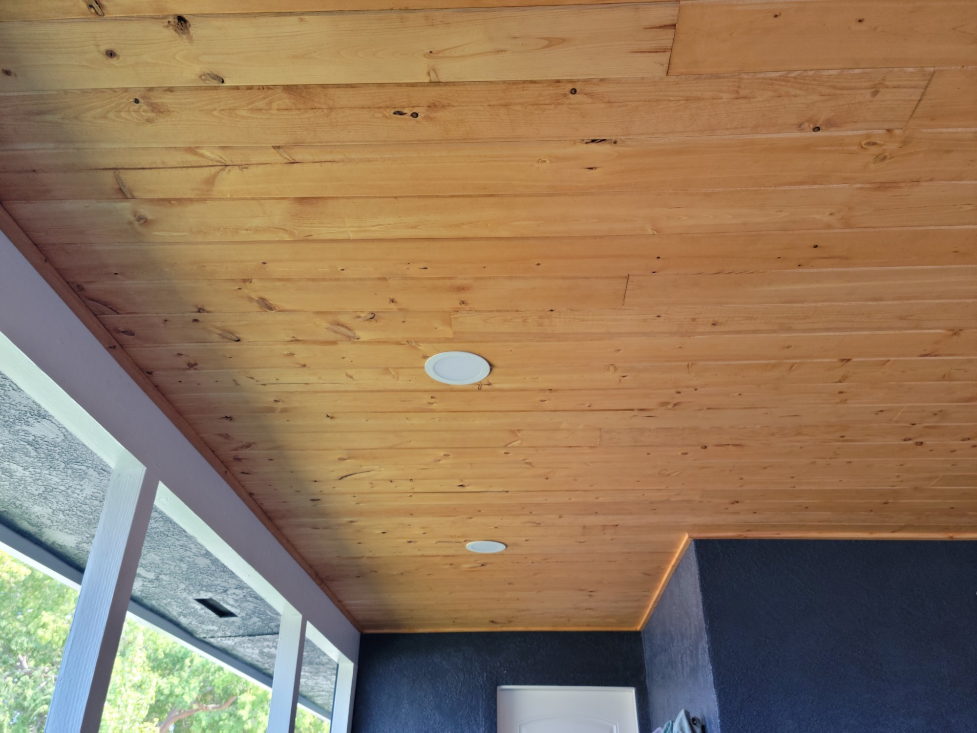Finished cedar soffit ceiling with integrated recessed lighting in Land Park