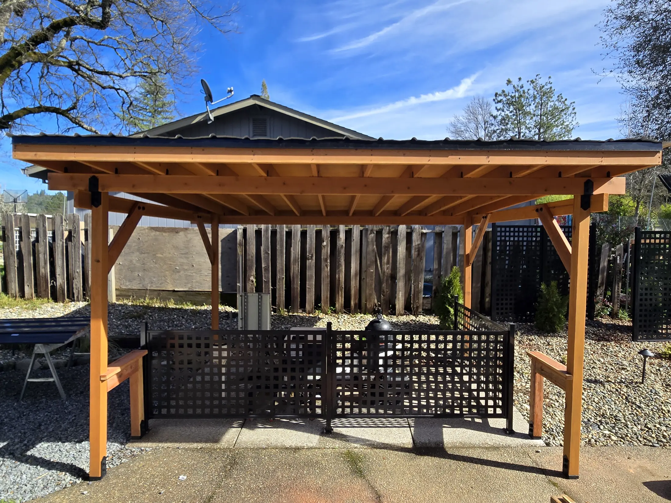 Straight-on view of the completed poolside timber structure