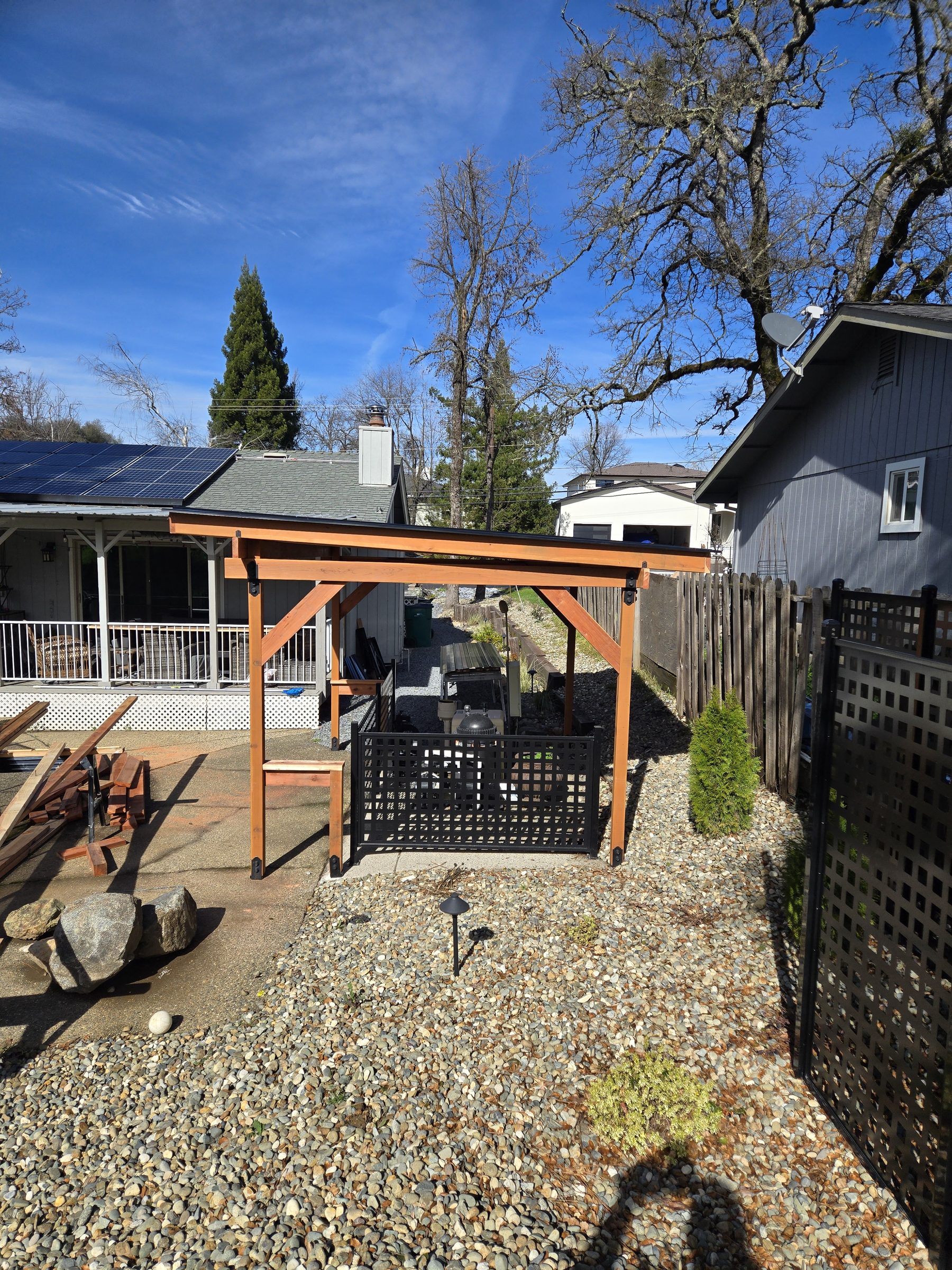 Side view of the shade structure and gravel yard