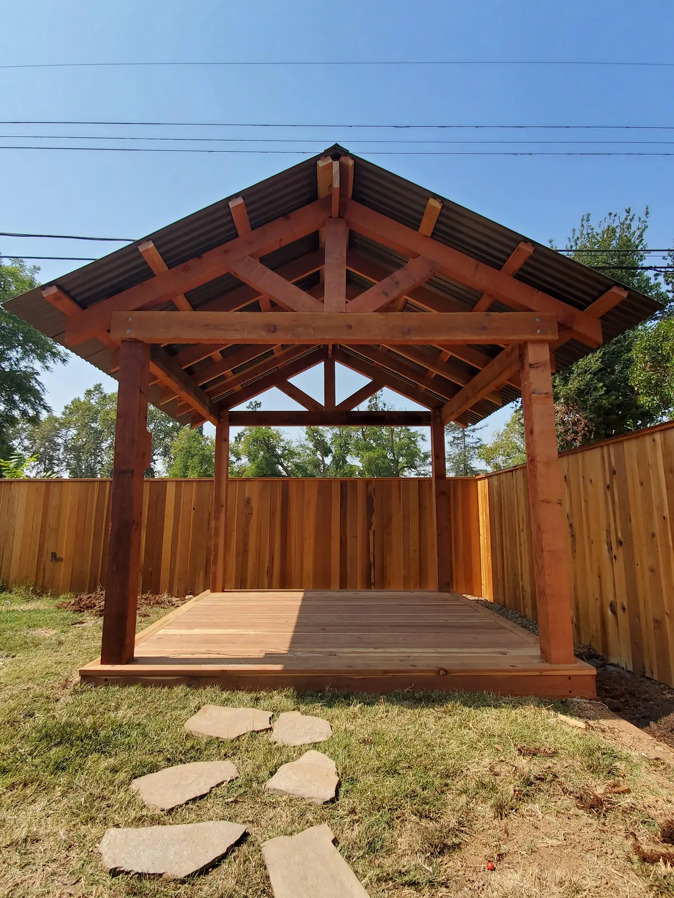 Completed timber gazebo with exposed trusses and metal roof in Tahoe Park